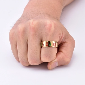 Detailed view of gold rotating spinner ring featuring colorful enamel reindeer and Christmas tree