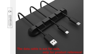 Close-up of 5-slot silicone cable organizer fixing USB wires on a desk edge surface