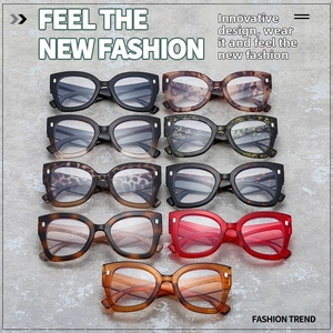 Detail view of stylish leopard print oversized blue light glasses in various colors