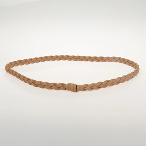 Detailed view of a brown braided faux suede waist belt with a wrapped end design