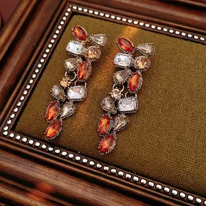 Vintage palace style tassel earrings with amber rhinestones and antique gold finish