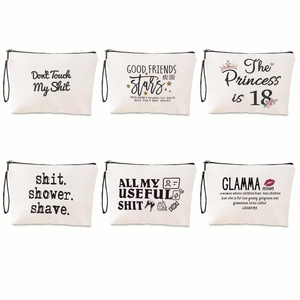 Set of six white canvas cosmetic bags with black zippers and humorous typography prints
