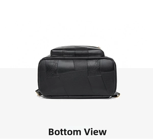 Detail view of the durable black leather backpack bottom with golden metal hardware