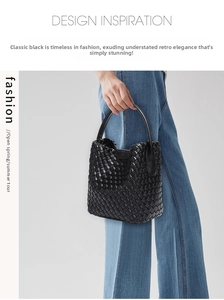 Close-up of black woven leather tote bag texture with minimalist cross-weave pattern