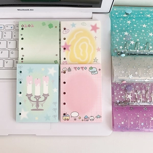 Macro shot of M5 star-patterned laser PVC binders with colorful 6-hole inner pages