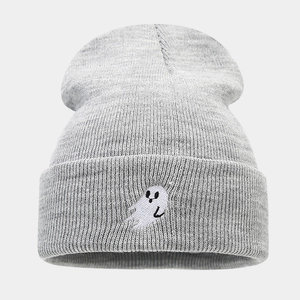 Close-up of the light gray knit beanie featuring a small white ghost embroidery detail