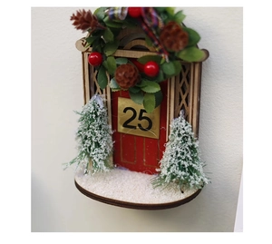 Miniature wooden red Christmas door with golden 25 plate and snowy trees detail
