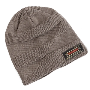 Detailed knit texture and classic leather patch on a warm winter beanie hat