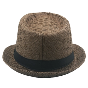 Detailed view of the brown straw jazz hat's woven texture and black ribbon band