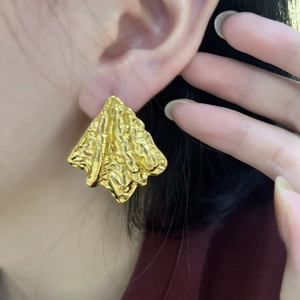 Textured gold-plated lava-style irregular hoop earrings with wrinkled metal finish