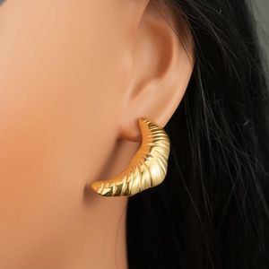 Vintage 18k gold plated stainless steel croissant earrings shown on female model