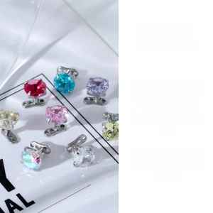 Macro shot of colorful zircon dermal anchor jewelry in G23 titanium with internal threading