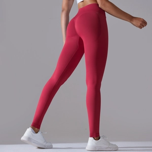 Close-up of red high-waisted seamless yoga leggings with peach butt-lifting texture