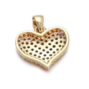 Macro view of gold heart pendant with hollow back showing colorful zircon stones