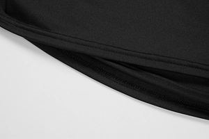 Detailed close-up showing neat double-needle stitching and overlock seams on black fabric