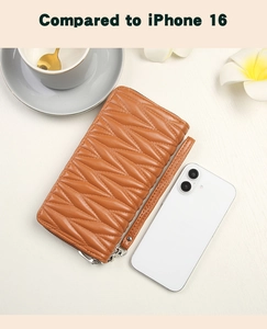 Brown quilted long wallet with wristlet next to a phone for size comparison