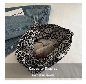 Top view of leopard print canvas bag showing large interior space for daily essentials