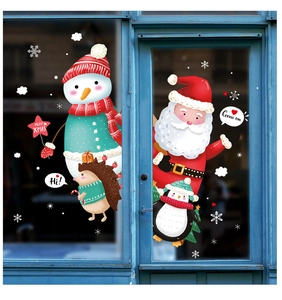 Detail of Christmas window stickers featuring Santa, snowman and Merry Xmas text