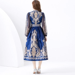 Elegant navy V-neck wrap dress with golden paisley print and sheer lantern sleeves