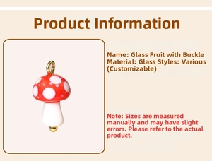 Detailed view of mushroom-shaped glazed glass pendant with red polka dots and gold buckle