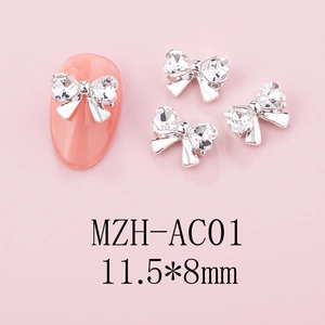 Macro detail of silver bow tie nail art charm with crystal rhinestones 11.5x8mm