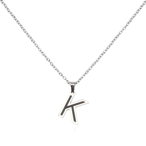 Detailed shot of silver steel necklace with letter K black enamel square pendant