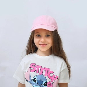 Pink solid color baseball cap for kids paired with a white cartoon character t-shirt