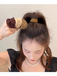 Detail of soft high-elastic hair ties used for styling high ponytail on model back view
