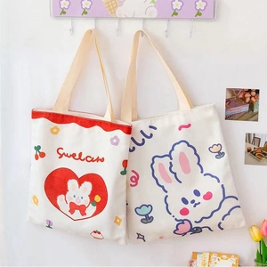 Cute canvas tote bags for students featuring heart bunny prints and durable handles