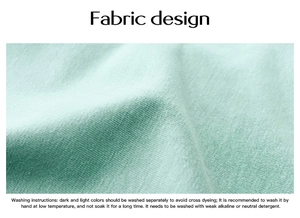 Detail of mint green breathable fabric with soft texture and care instructions label