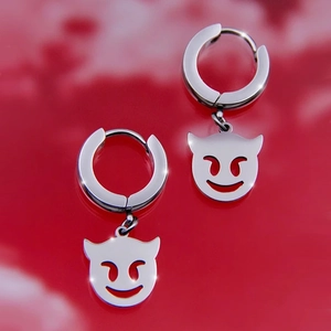 Polished stainless steel hoop earrings featuring hollow smiling devil face pendants