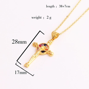 Detail view of gold cross pendant with colorful zircons and precise measurements