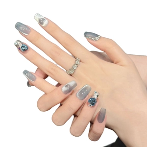 Short square grey cat eye press-on nails with blue heart gems and silver glitter accents