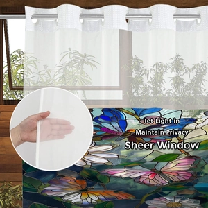 Close-up of stained glass style shower curtain fabric showing light filtering textures
