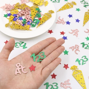 Colorful glitter school confetti with stars and numbers for back to school party decor