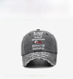 Detail of distressed grey washed baseball cap with vintage letter embroidery and worn edges