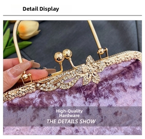 Close-up of purple velvet evening clutch with luxury gold rhinestone clasp and round handle