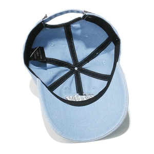 Detail of internal VUITTON embroidery on blue baseball cap with silver metal buckle