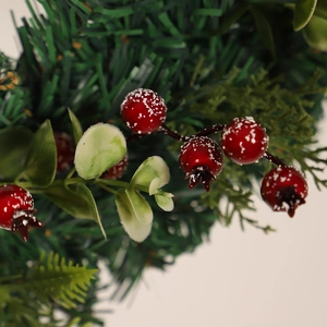Artificial Christmas wreath with eucalyptus leaves and red berries with snow effect