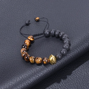 Braided bracelet featuring tiger eye stones, lava beads and a gold spartan helmet charm