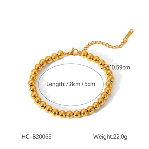 Detail view of 18K gold stainless steel ball bracelet with size and weight dimensions