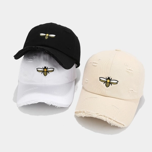 Vintage distressed baseball caps with bee embroidery in black, white, and beige colors