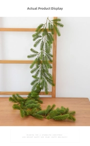 Detailed view of 1.5m artificial spruce garland hung on a ladder for Xmas decor