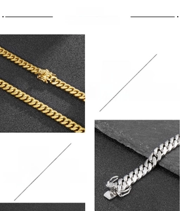 Detail of 316L stainless steel Cuban chain link showing secure lobster clasp and texture