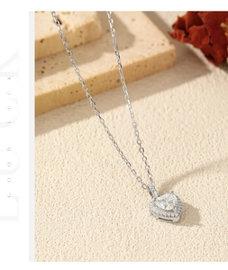 Detail view of heart-shaped moissanite pendant with micro-pave halo on S925 silver chain