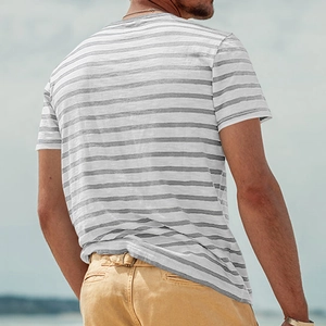 Detail view of the back of a men's grey and white striped crew neck t-shirt in breathable fabric