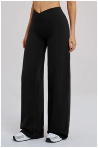 Détail du pantalon de yoga à taille haute avec ceinture croisée en V distinctive