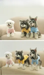 Front and side view of pet sweaters in pink, yellow and blue on small dogs