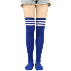 Close-up of blue over-knee socks featuring three white stripes in a sporty college style