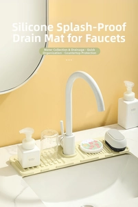 Close-up of cream silicone faucet draining mat with soap dispenser and cleaning tools